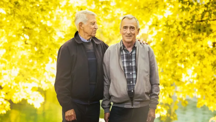 two elderly men standing together